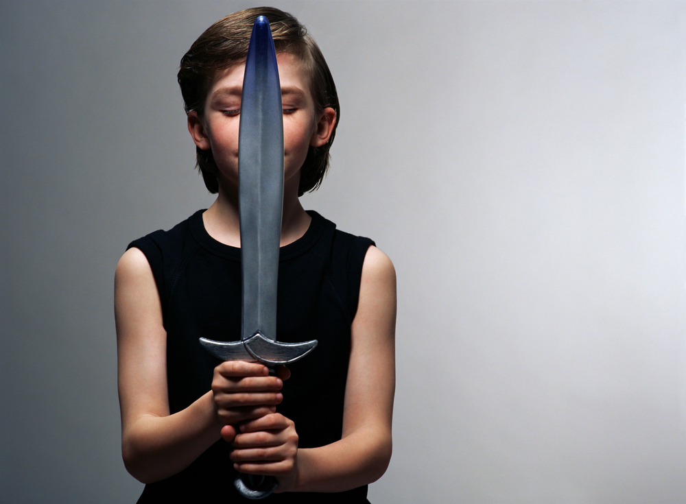 Boy holding dirk